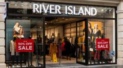 Read more about the article River Island allowed to shut shops to stave off collapse