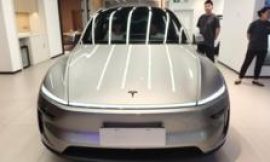 Tesla earnings slide despite record revenue