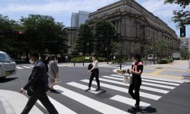 BOJ holds rates steady, keeps future hikes in view