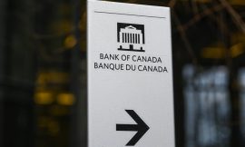 Bank of Canada holds key rate at 2.25%, warns on US