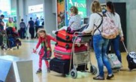 Ryanair says it will reluctantly not charge parents to sit next to children