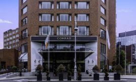 NFL game helped Conrad Hotel to almost double profiits