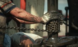 Oil retreats from above $100, still set for weekly rise