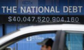 How does the US national debt affect consumers around the world?